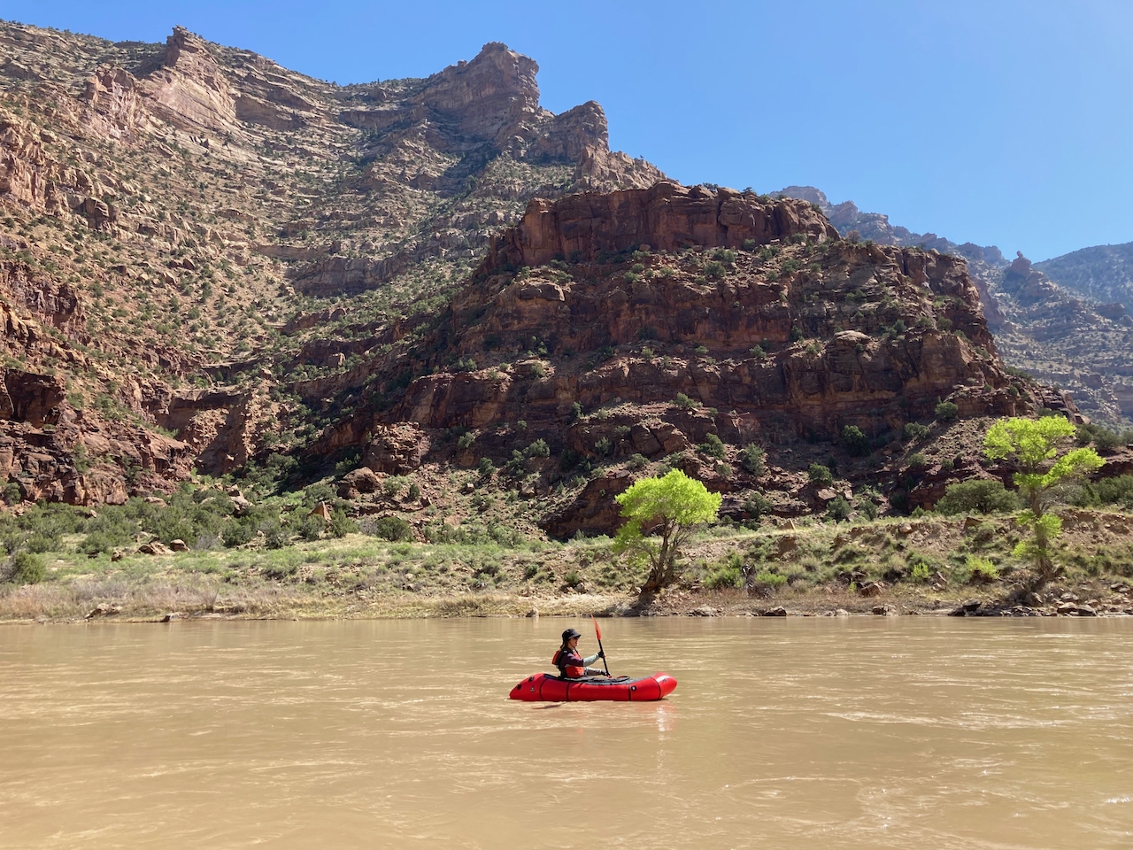 packraft on muddy river