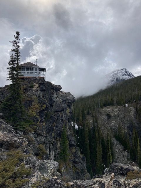 a house sitting on top of a rocky cliff