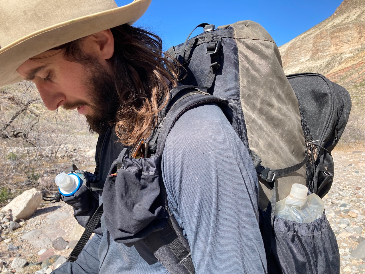 A medium close-up of a man wearing the Waymark Gear Company Lite 50L