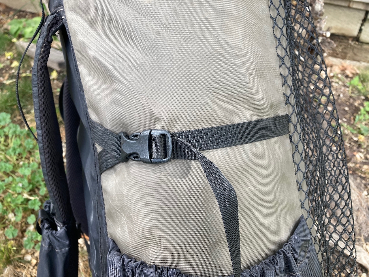 A close-up shot of the Waymark Gear Company Lite 50L's compression strap.