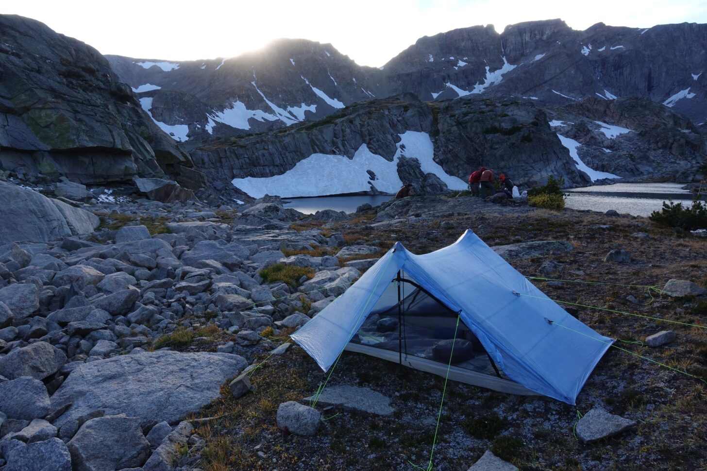 tent in the mountains by a lake