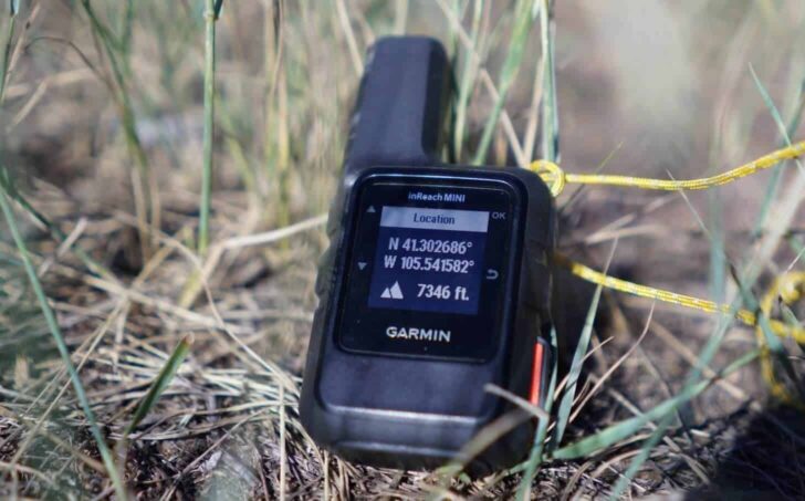 a close-up shot of a garmin inreach mini displaying gps data