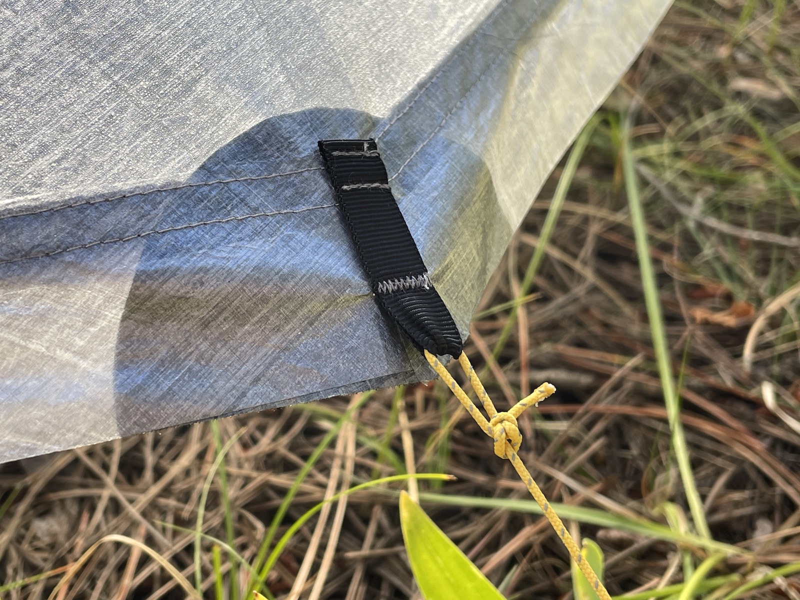 a close up of an umbrella on the ground