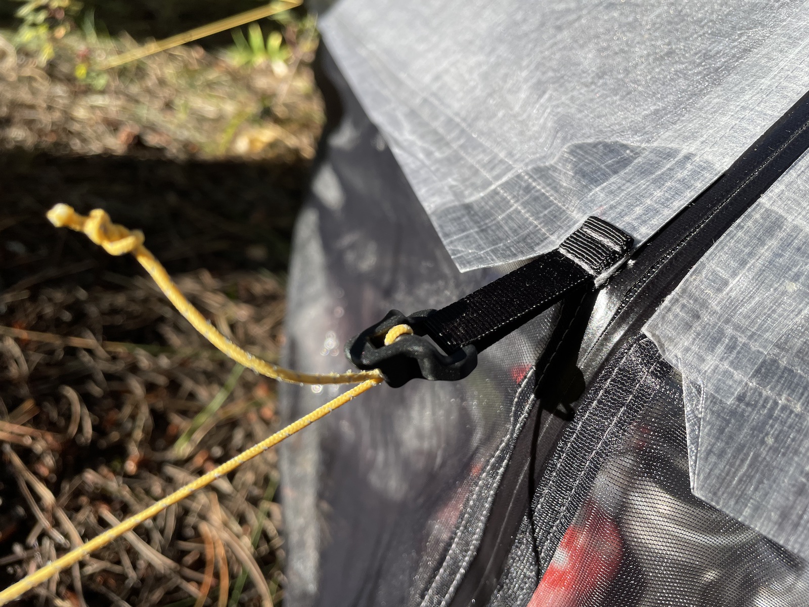 a close up of an umbrella with a cord attached to it