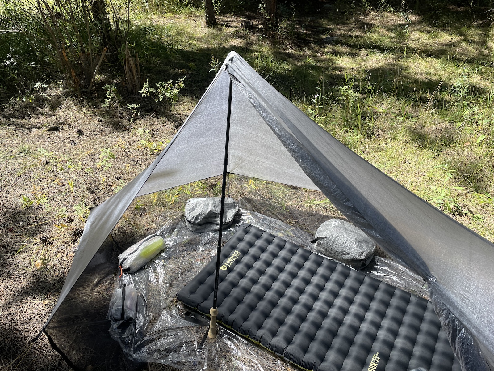 an inflatable bed in the middle of a field