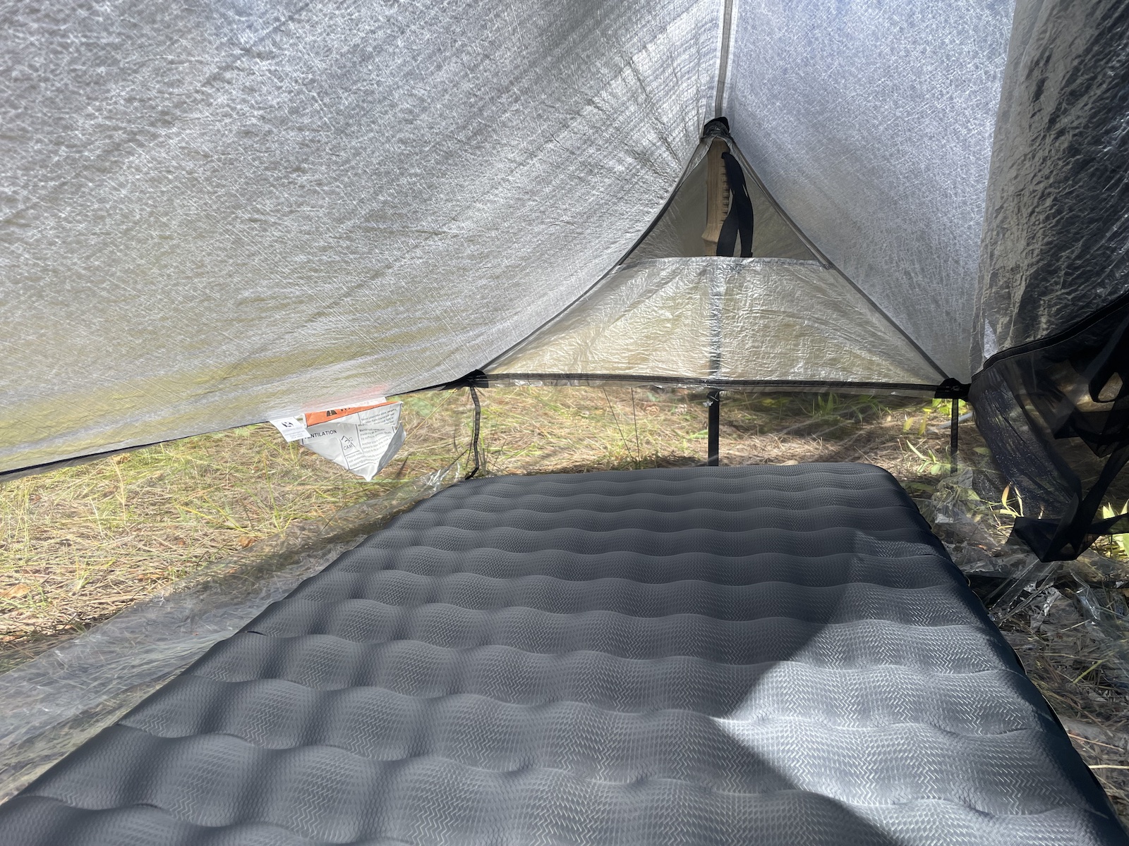 a tent with a mattress inside of it