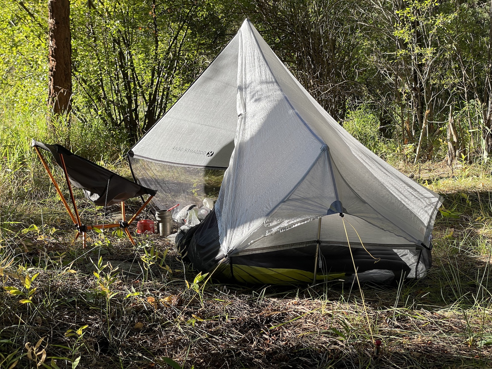 a tent is pitched up in the woods