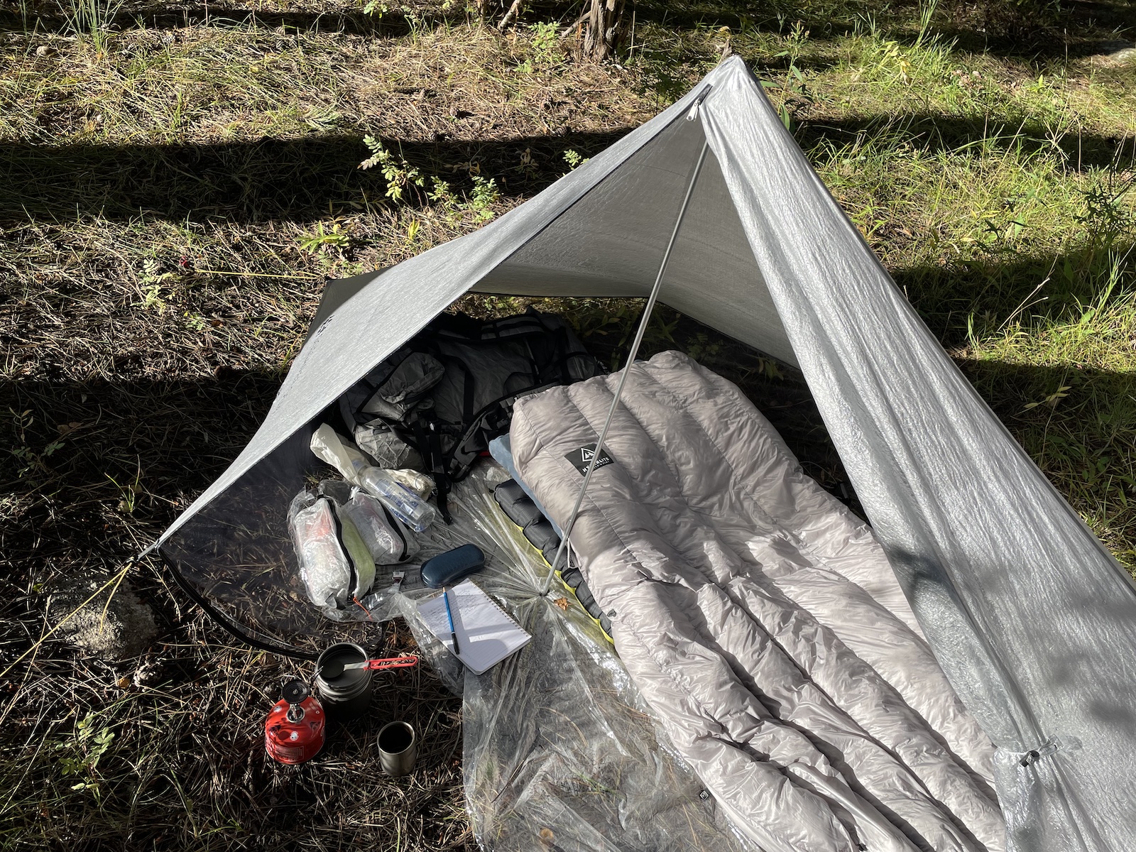 a tent with a sleeping bag inside of it