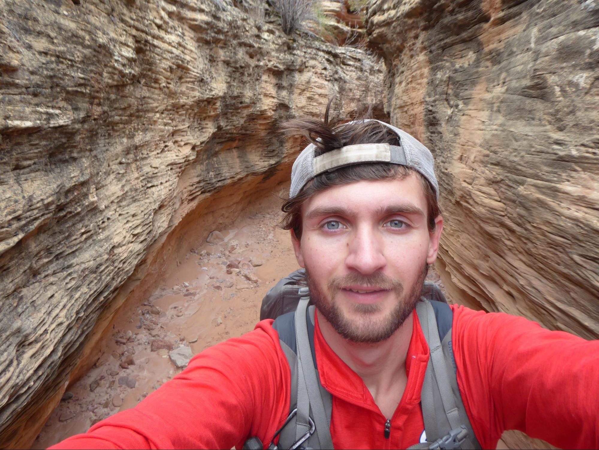 a man taking a selfie in a canyon