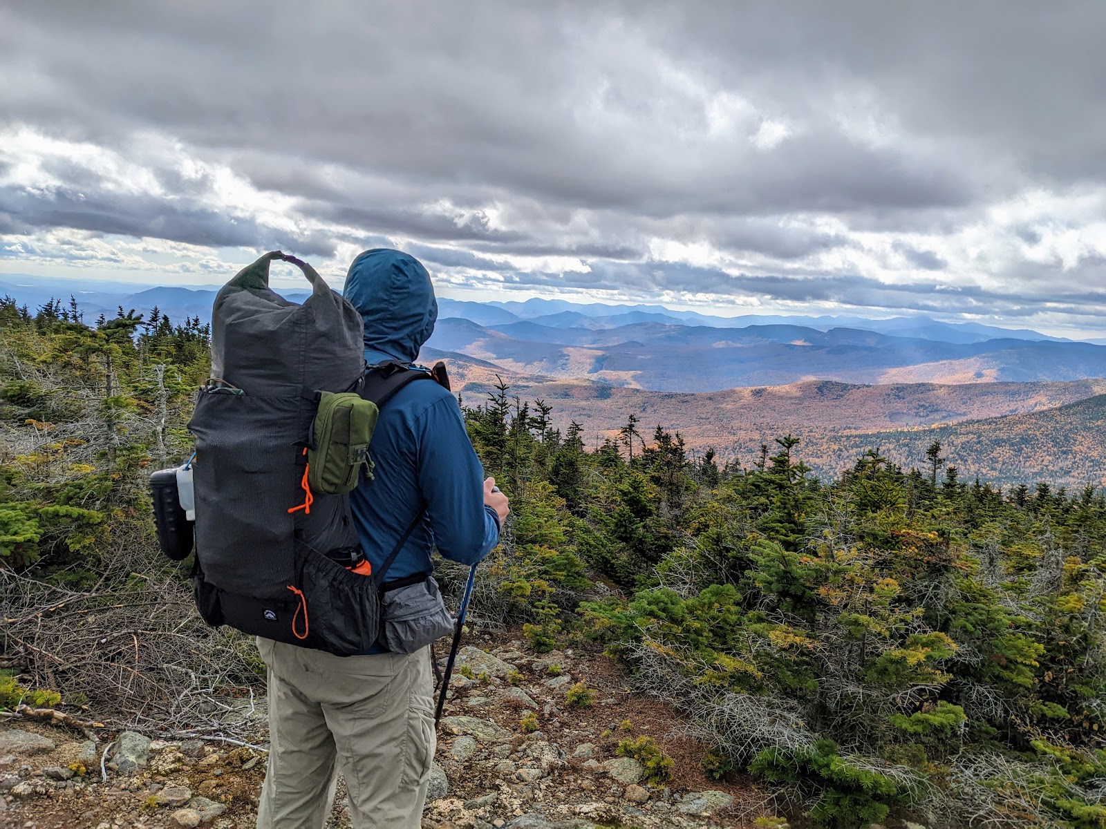 Man looking over mountain valley