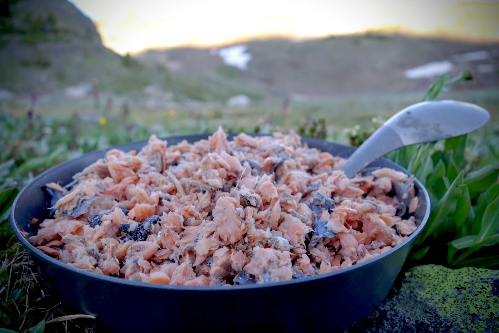 a bowl of food with a spoon in it