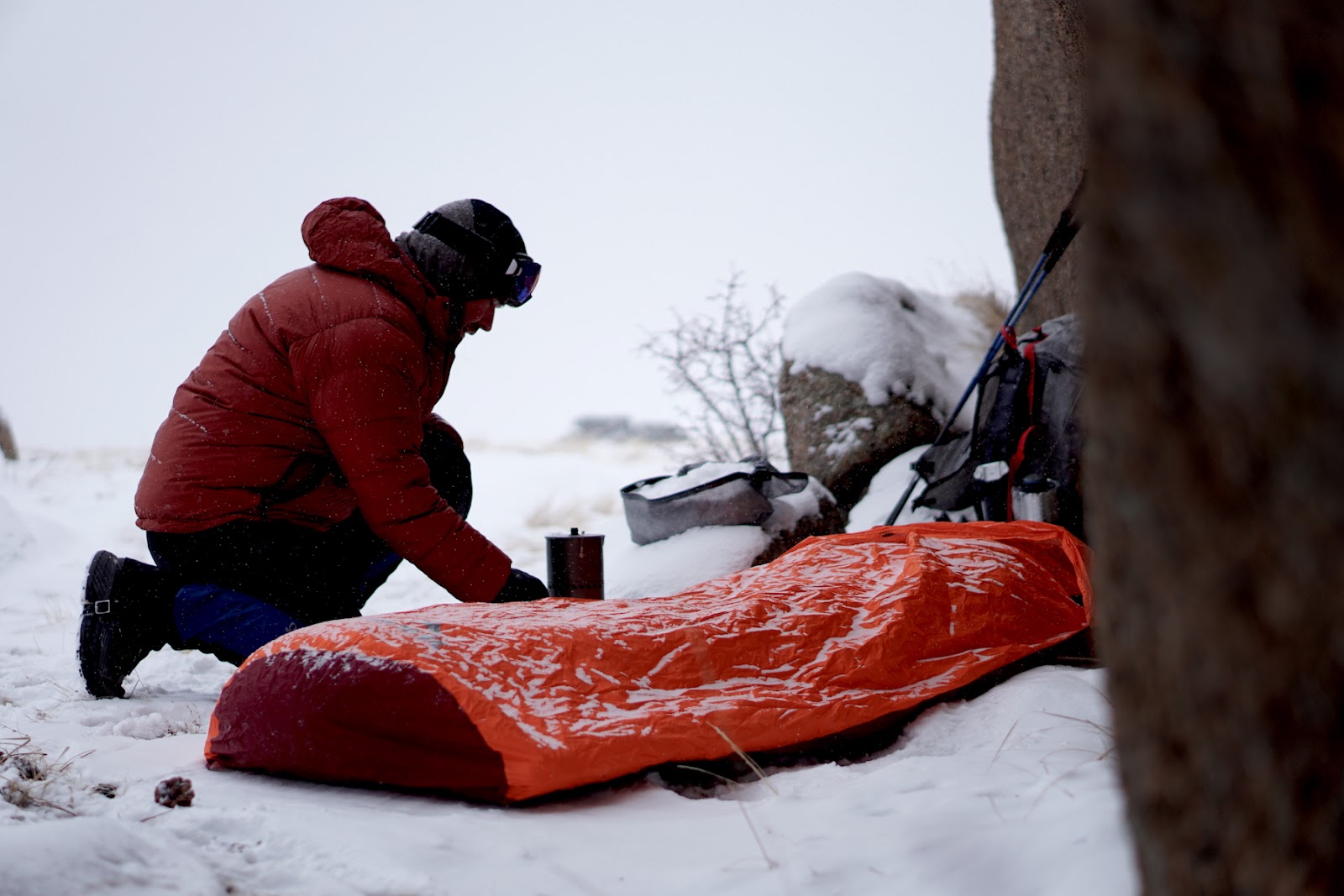 Hiker using stove in snow