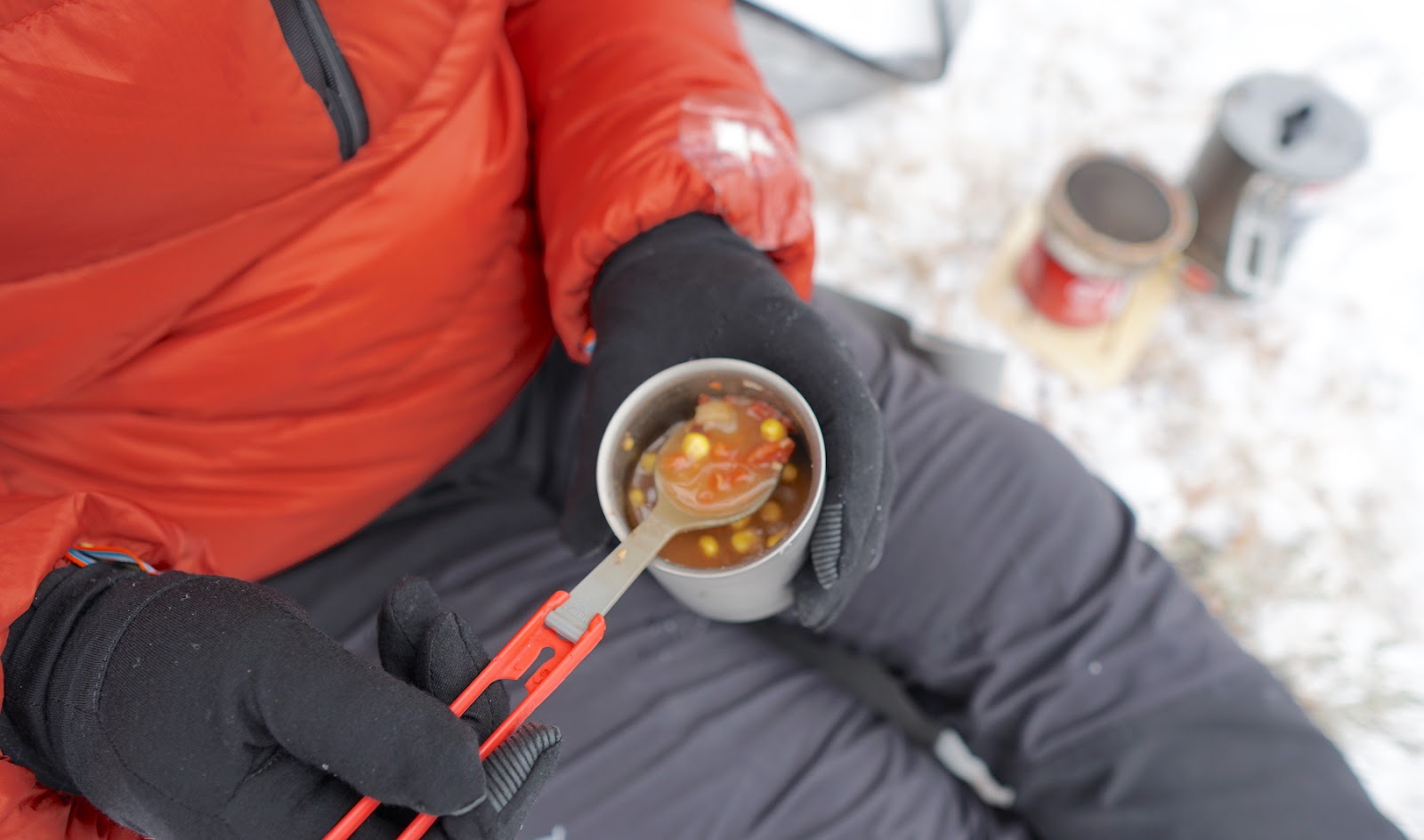 Hot soup in spoon.