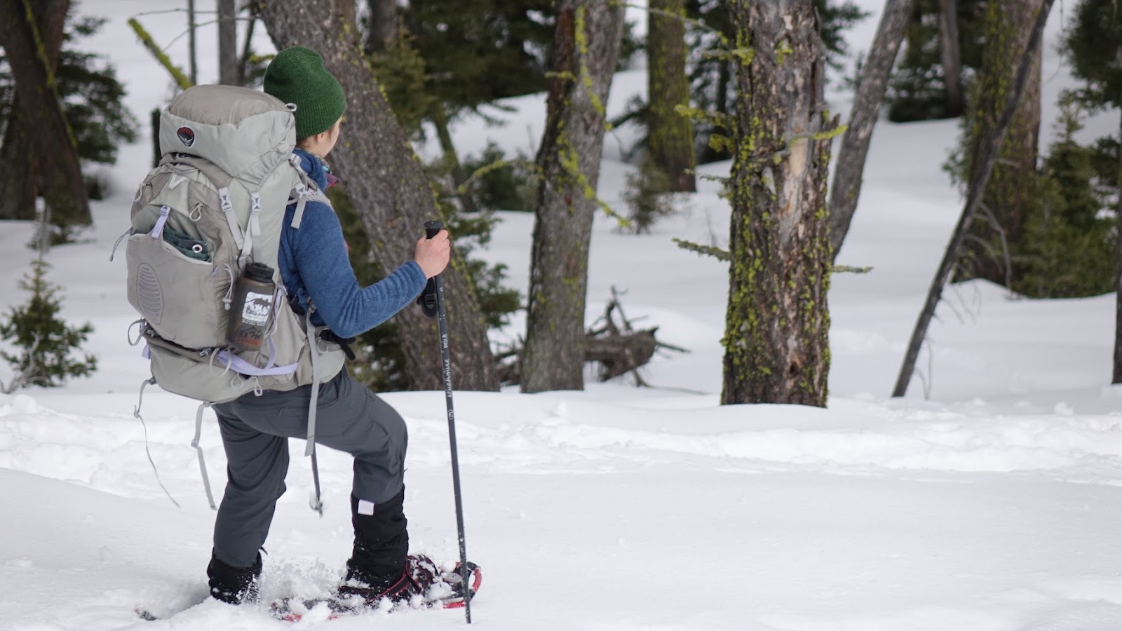 Hiker snowshoeing in deep snow