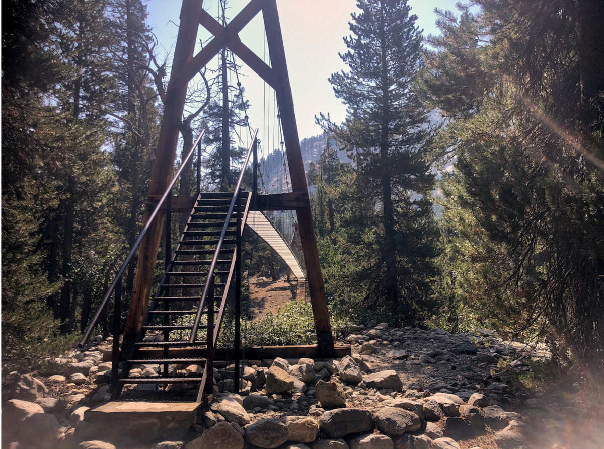 a wooden tower with a ladder on top of it