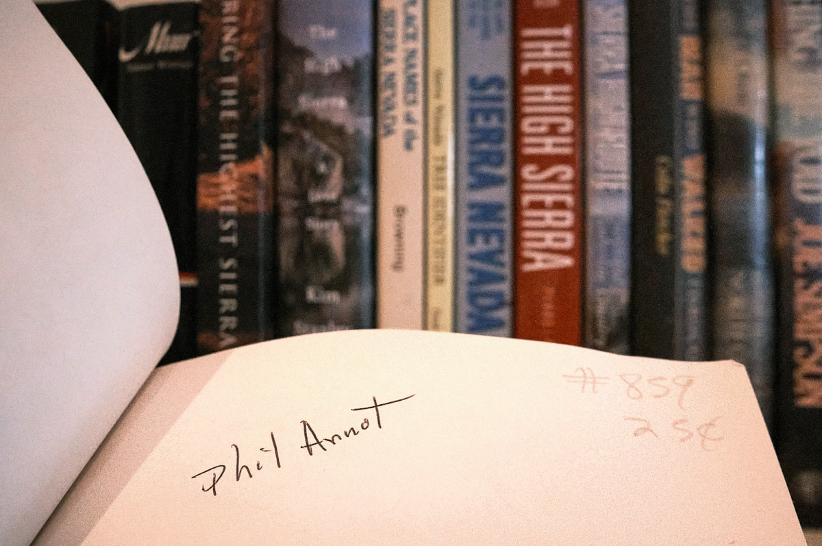 a close up of a book shelf with a bunch of books