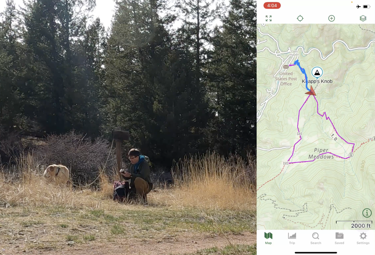 A man crouches near a sign and looks at his phone. On the right hand side of the screen, there is a screen shot showing where's he's been on his map. 